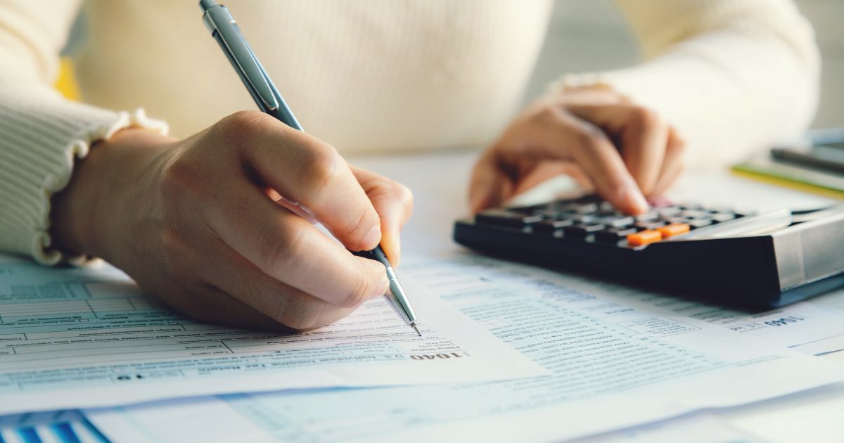 woman filling out tax information to avoid identity theft