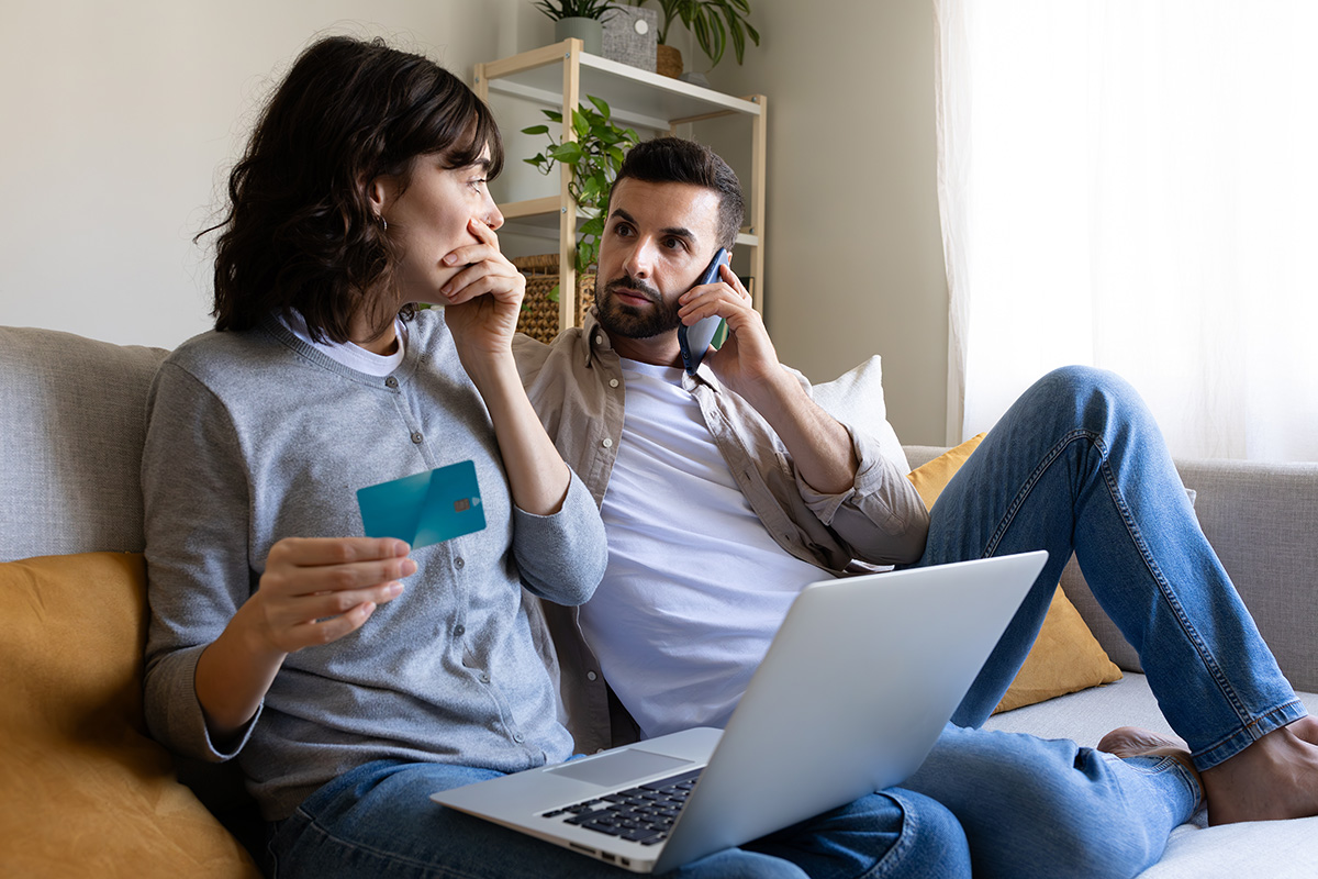 Shocked couple calling bank about unauthorized charges