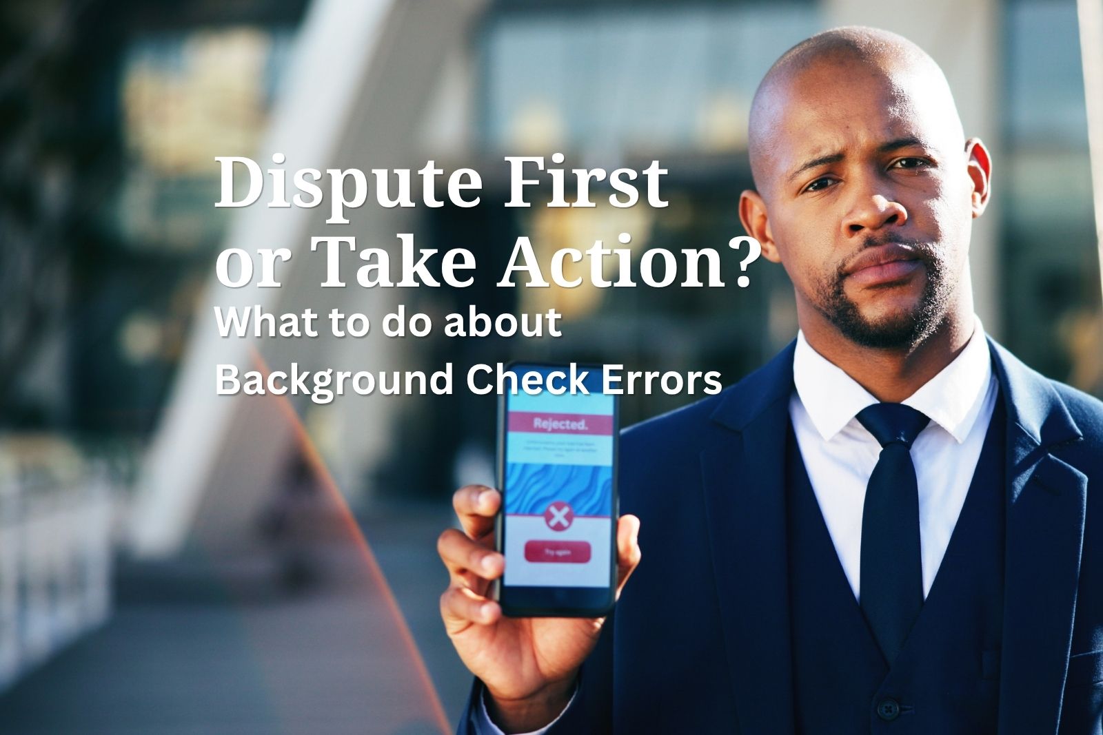 man holding phone with rejection letter after being denied a job or housing due to errors on his background check